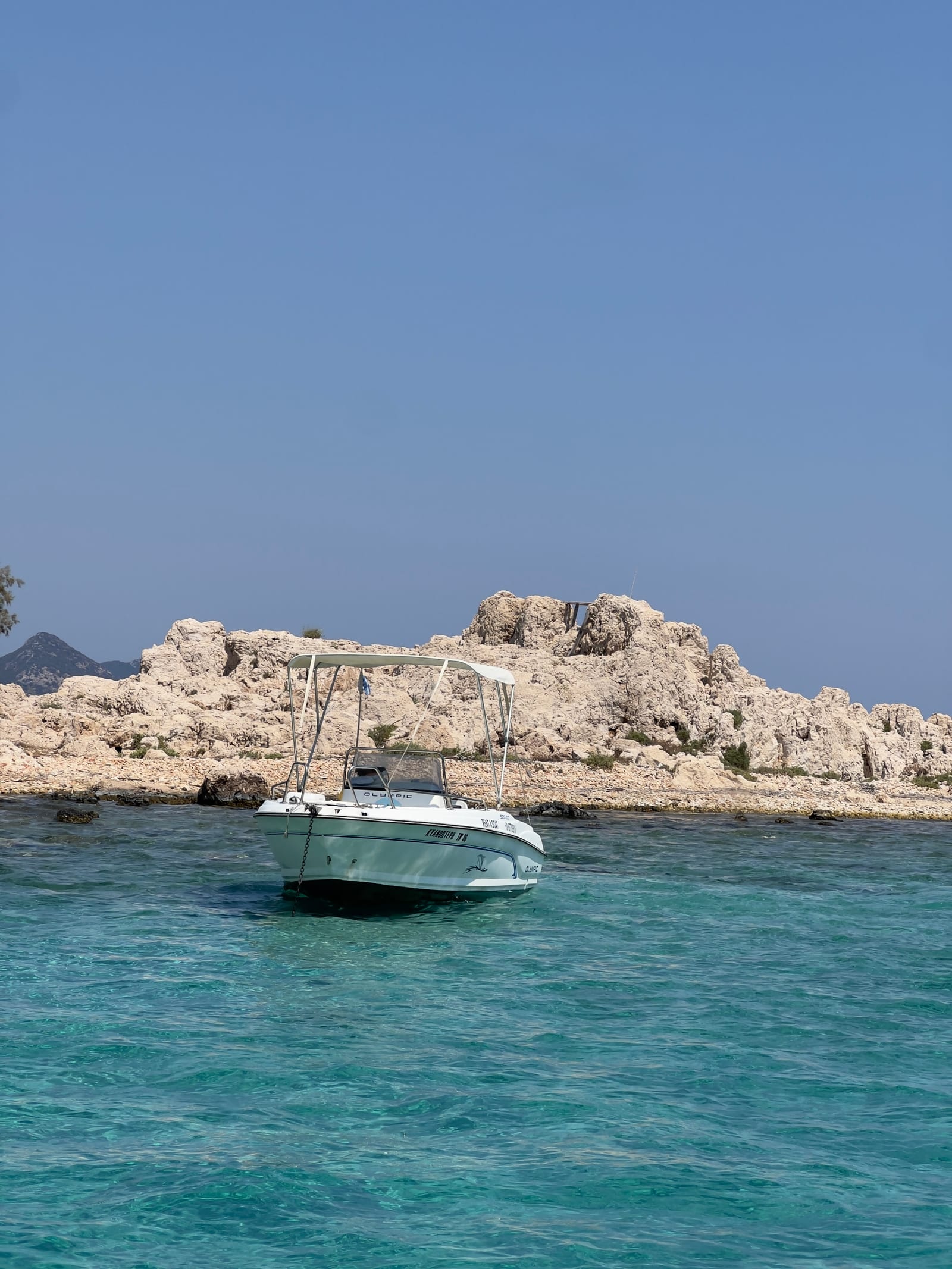 Κυανόπτερη anchored in turquoise water near Kastellorizo